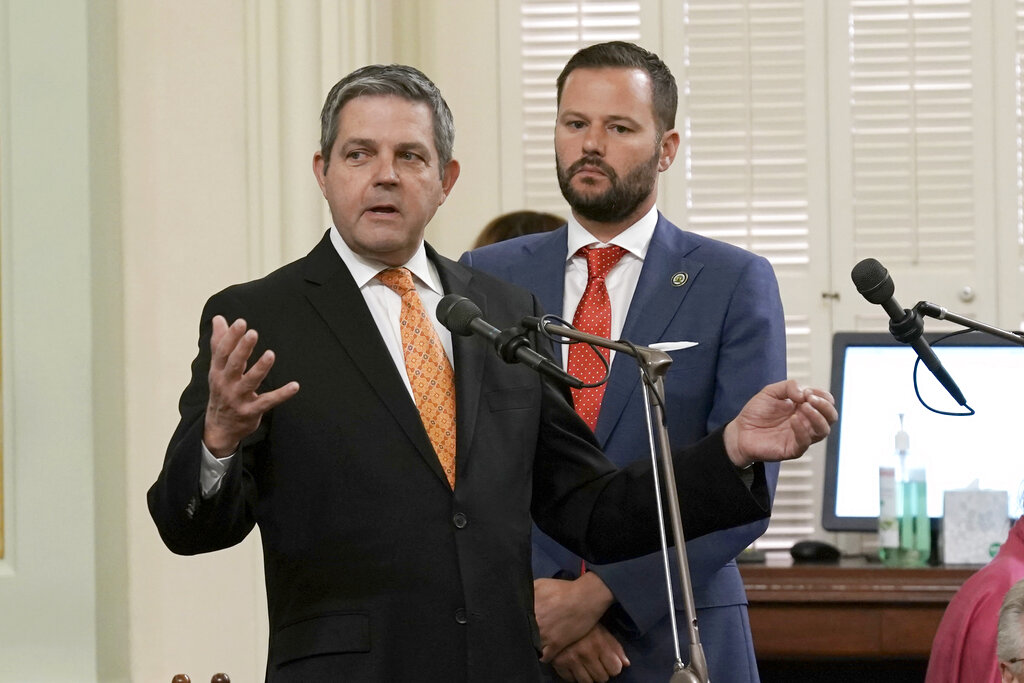 Assemblyman Jim Wood, D-Santa Rosa, left, calls on lawmakers to approve a measure carried by Assemblyman Matt Haney, D-San Francisco, right, to allow Los Angeles, Oakland and San Francisco, to set up places where opioid users could legally inject drugs in supervised settings, during the Assembly session in Sacramento, Calif., on Thursday, June 30, 2022. The Assembly approved the measure and sent it to back to the Senate for final consideration. (AP Photo/Rich Pedroncelli)
