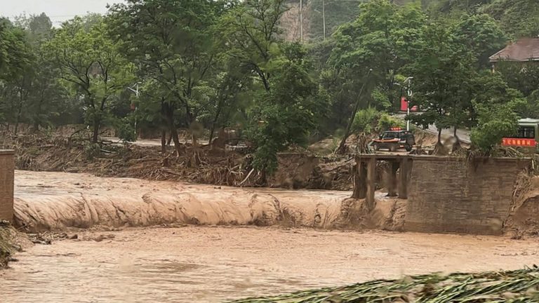 China floods leave at least 12 dead, thousands evacuated