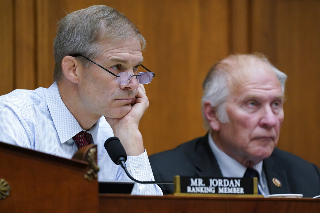 Rep. Jim Jordan, R-Ohio, left, and Rep. Steve Chabot, R-Ohio, listen as the House Judiciary Committee holds a hearing on the future of abortion rights after the overturning of Roe v. Wade by the Supreme Court, at the Capitol in Washington, Thursday, July 14, 2022. (AP Photo/J. Scott Applewhite)
