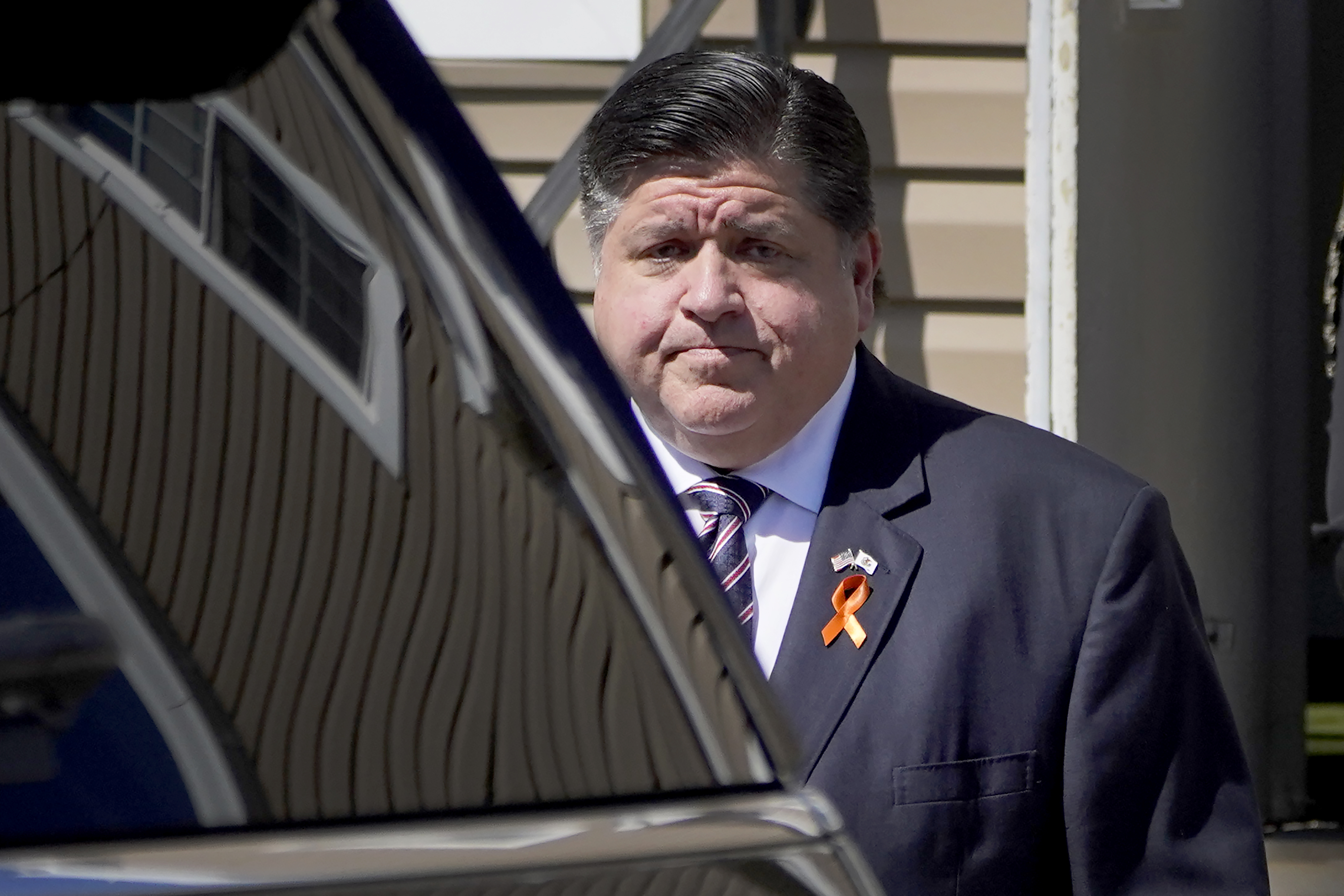 Illinois Gov. J.B. Pritzker departs the Memorial Chapel Funeral Home after visiting the family of Eduardo Uvaldo, who was killed Monday during a mass shooting at the Fourth of July parade in Highland Park, Ill., Saturday, July 9, 2022, in Waukegan, Ill. (AP Photo/Charles Rex Arbogast)