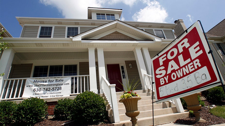 A for sale sign sits outside a home in Illinois