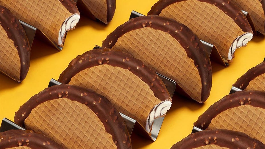 Several Choco Tacos are pictured on a yellow background
