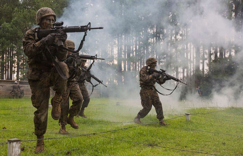 PHOTO: Recruits of Charlie Company, 1st Recruit Training Battalion, glide through a combat training course, June 9, 2015, on Parris Island, S.C.