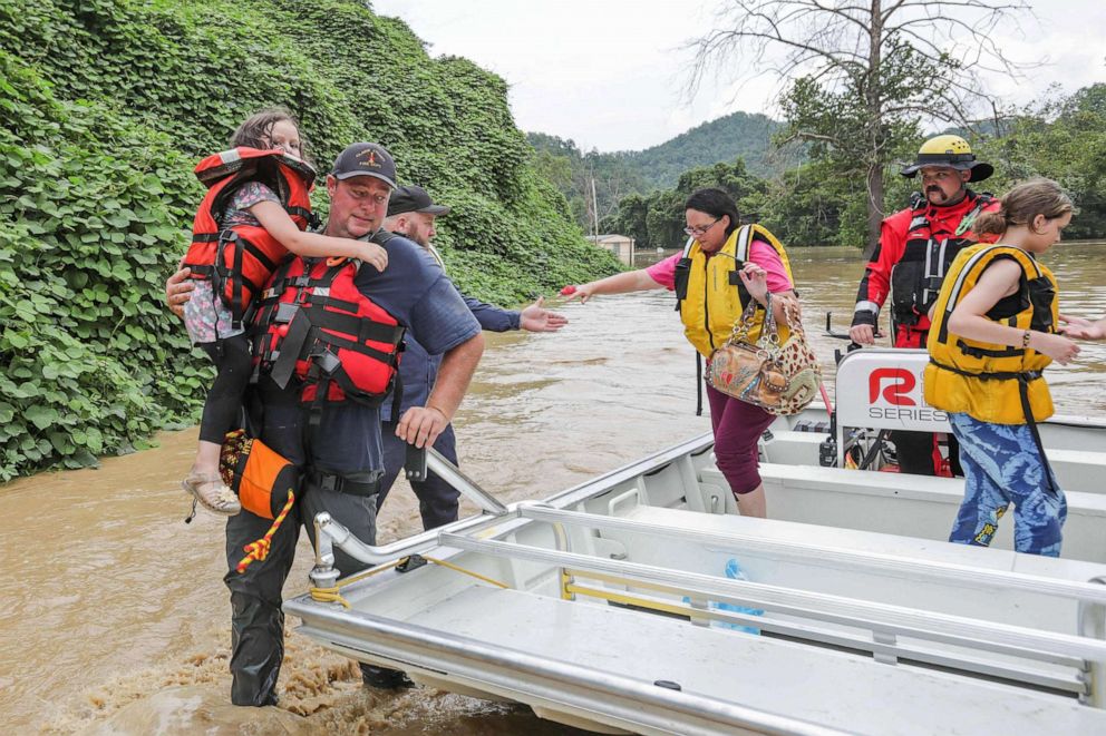 PHOTO: A group of stranded people are rescued from the flood waters of the North Fork of the Kentucky River in Jackson, Ky., on July 28, 2022. 