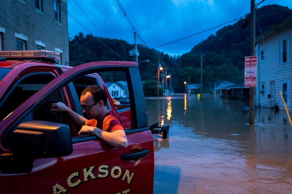 PHOTO: A member of the Jackson Fire Dept. reacts outside his vehicle downtown on July 28, 2022 in Jackson, Ky. Storms that dropped as much as 12 inches of rain in some parts of Eastern Kentucky have caused devastating floods in some areas.
