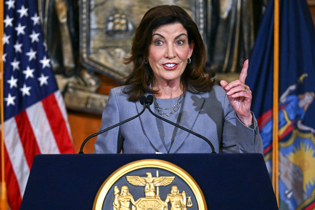 FILE - New York Gov. Kathy Hochul speaks to reporters in the Red Room at the state Capitol, July 1, 2022, about legislation passed during a special legislative session, in Albany, N.Y. A federal lawsuit challenging part of New York's new gun law was filed by Republican congressional candidate Carl Paladino, one of multiple legal challenges expected against state handgun licensing rules approved after a recent Supreme Court ruling. (AP Photo/Hans Pennink, File)