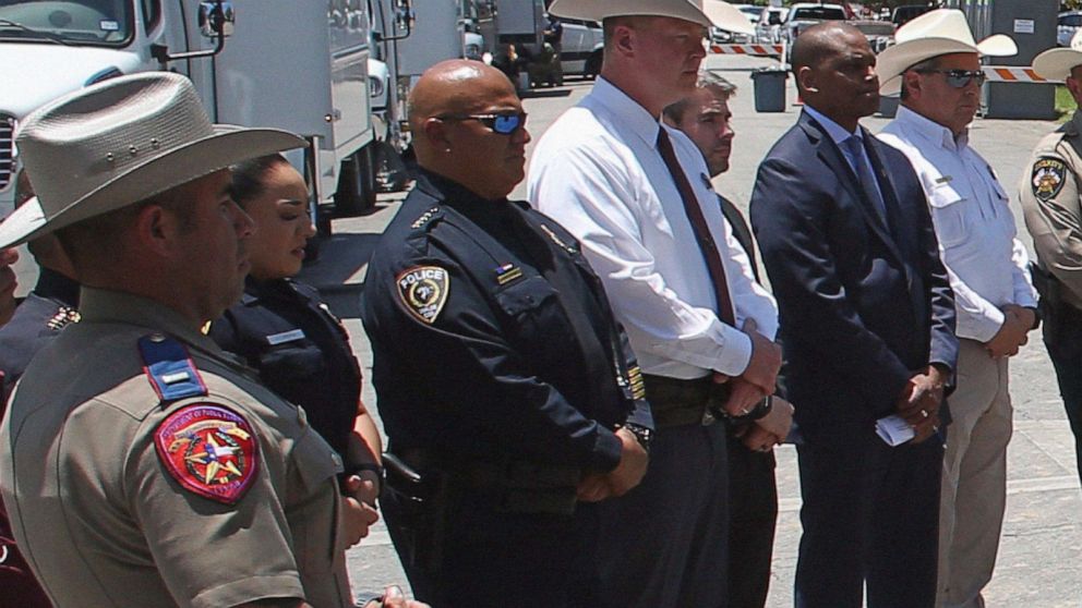 PHOTO: Uvalde School Police Chief Pete Arredondo, third from left, stands during a news conference outside of the Robb Elementary school in Uvalde, Texas, May 26, 2022. 