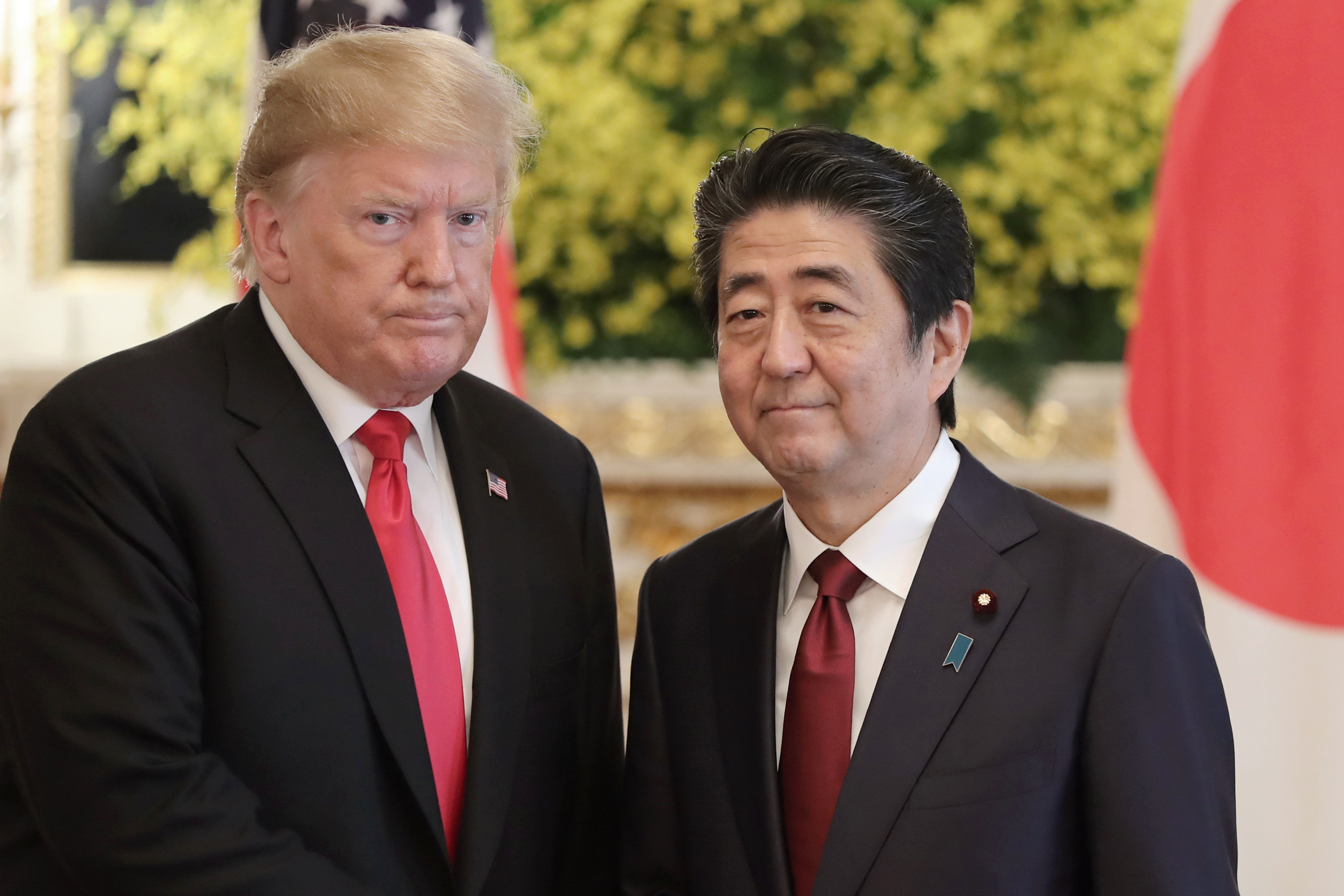 FILE - U.S. President Donald Trump, left, and Japanese Prime Minister Shinzo Abe pose for a photo prior to their meeting at Akasaka Palace, Japanese state guest house, in Tokyo on May 27, 2019. Former Japanese Prime Minister Abe, a divisive arch-conservative and one of his nation's most powerful and influential figures, has died after being shot during a campaign speech Friday, July 8, 2022, in western Japan, hospital officials said. (AP Photo/Eugene Hoshiko, File)