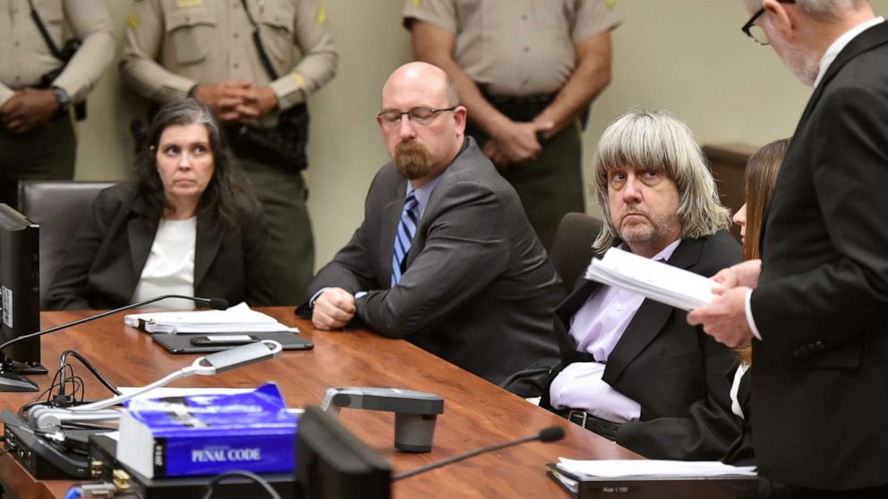 PHOTO: Louise Anna Turpin, far left, with attorney Jeff Moore, second from left, and her husband, David Allen Turpin, listen to attorney David Macher, as they appear in court for their arraignment in Riverside, Calif., Jan. 18, 2018.