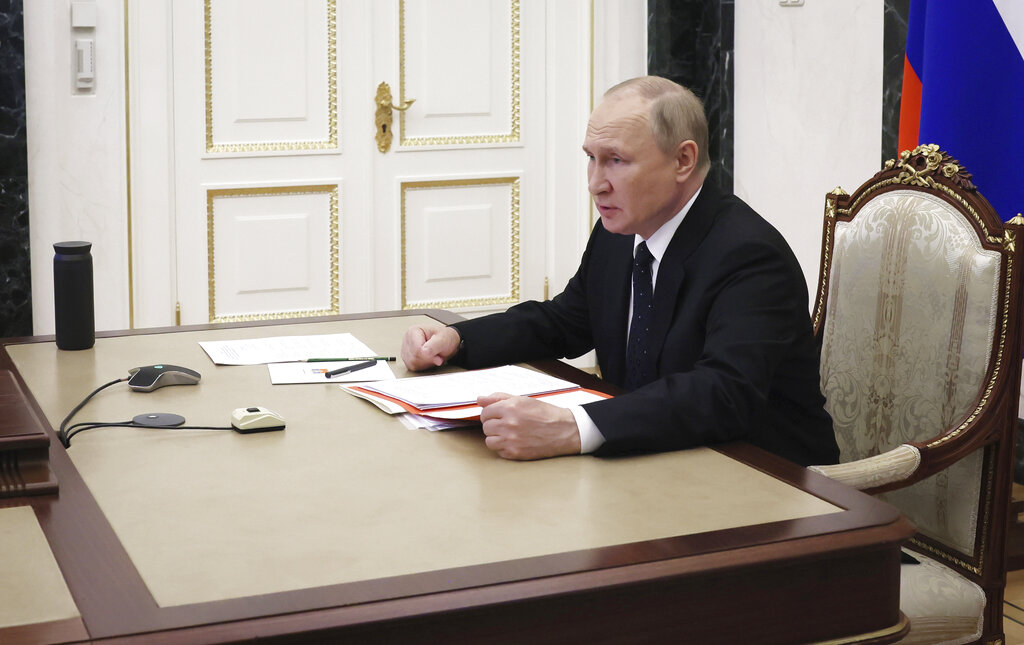 Russian President Vladimir Putin chairs a meeting with members of the Security Council via teleconference call in Moscow, Russia, Wednesday, June 22, 2022. (Mikhail Metzel, Sputnik, Kremlin Pool Photo via AP)