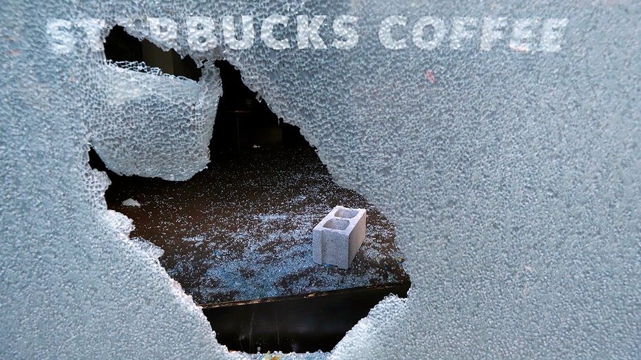 Protesters break Starbucks' glass