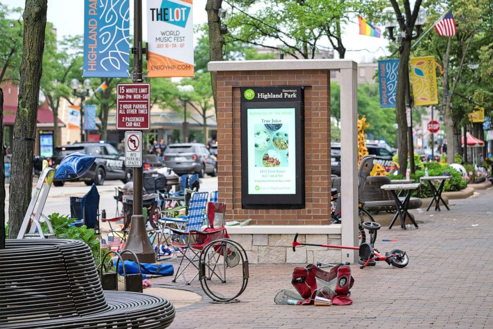 PHOTO: A chair and scooter are left knocked over at the scene of a mass shooting at a Fourth of July parade route in the wealthy Chicago suburb of Highland Park, Ill., July 4, 2022.