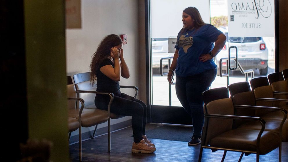 PHOTO: A patient is brought to tears as a staff member informs her that the clinic can no longer provide services at Alamo Womens Reproductive Service in San Antonio, Texas, June 24, 2022. 