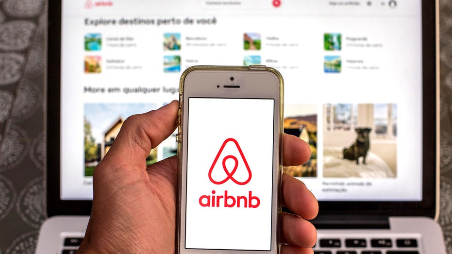 Airbnb logo on phone