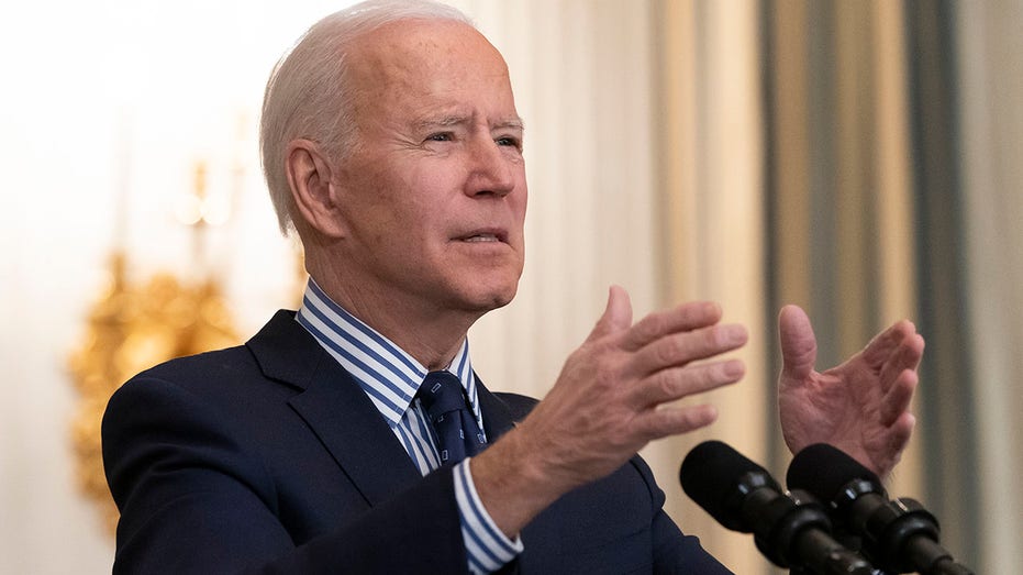 Joe Biden speaking while gesturing with his hands