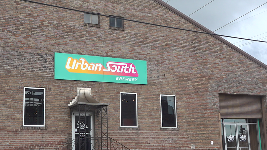 Outside shot of brick building with sign that says Urban South Brewery
