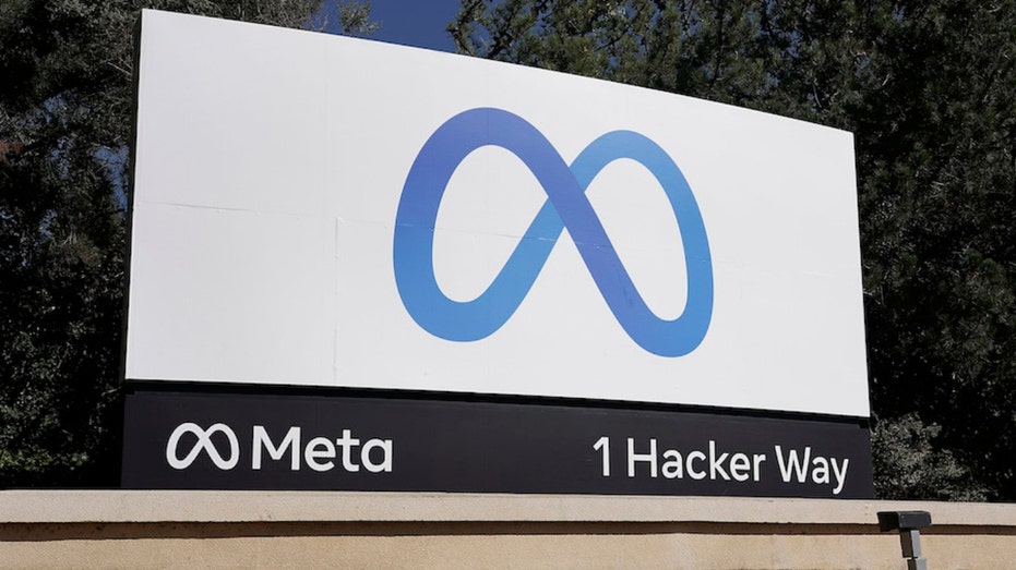 Meta's logo on a sign posted in front of the company's Menlo Park, California headquarters