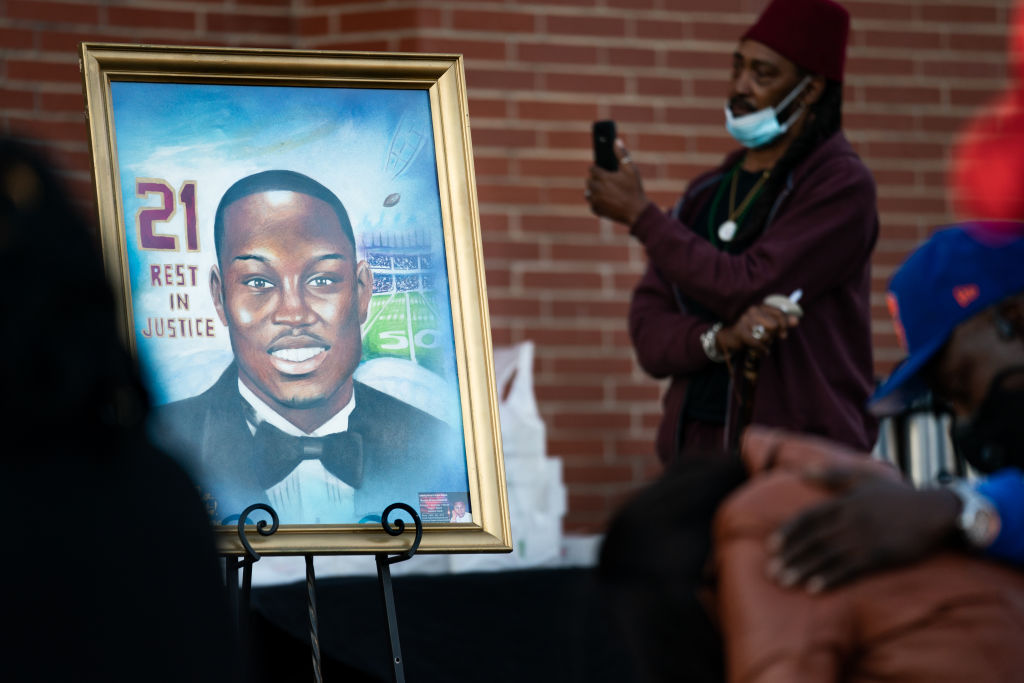 WAYNESBORO, GA - FEBRUARY 23: A painting of Ahmaud Arbery is displayed during a vigil at New Springfield Baptist Church on February 23, 2021 in Waynesboro, Georgia. Arbery, a Black man, was shot and killed while jogging near Brunswick, Georgia a year ago today after being chased by two white men. (Photo by Sean Rayford/Getty Images)