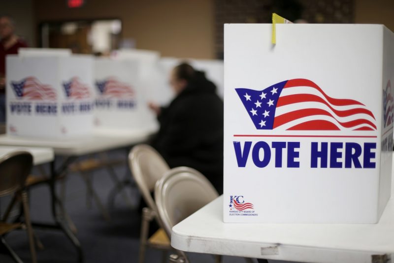 A woman votes in the presidential primary election at the the Summit View Church of the Nazarene in Kansas City, Mo., on March 10, 2020.Charlie Riedel / AP file