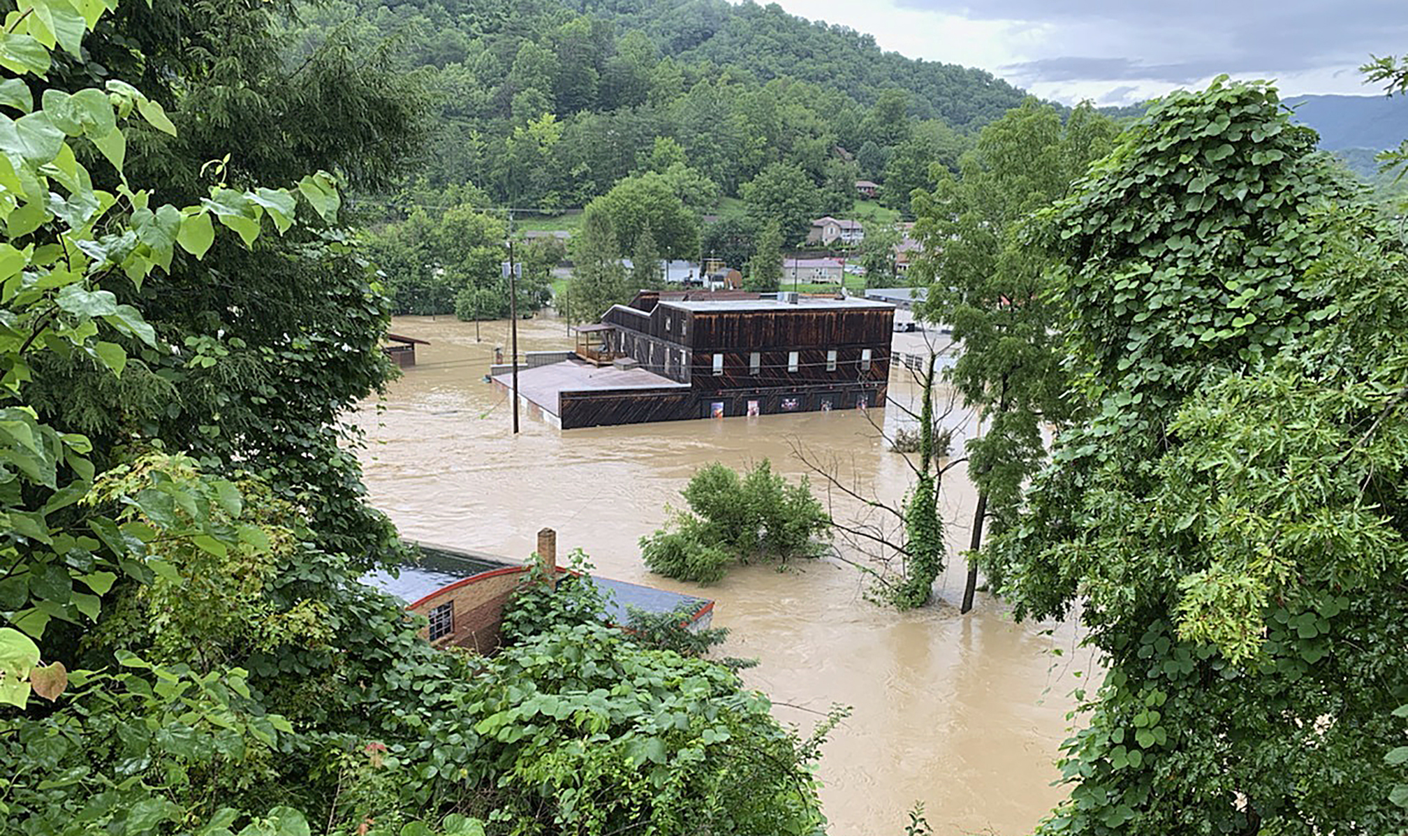 This July 28, 2022 photo provided by Appalshop shows the flooded Appalshop building in Whitesburg, Ky. The cultural center known for chronicling Appalachian life is cleaning up and assessing its losses. Like much of its stricken region, Appalshop has been swamped by historic flooding. The water inundated downtown Whitesburg in southeastern Kentucky, causing extensive damage to the renowned repository of Appalachian history and culture. (Appalshop via AP)