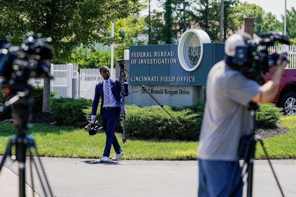 PHOTO: Members of the media stand outside of the FBI's Cincinnati Field Office, after police closed off Interstate 71 North after reports of a suspect attempting to attack the FBI building, in Cincinnati, Ohio, Aug. 11, 2022.