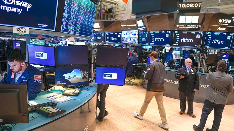 Workers on the floor of the New York Stock Exchange