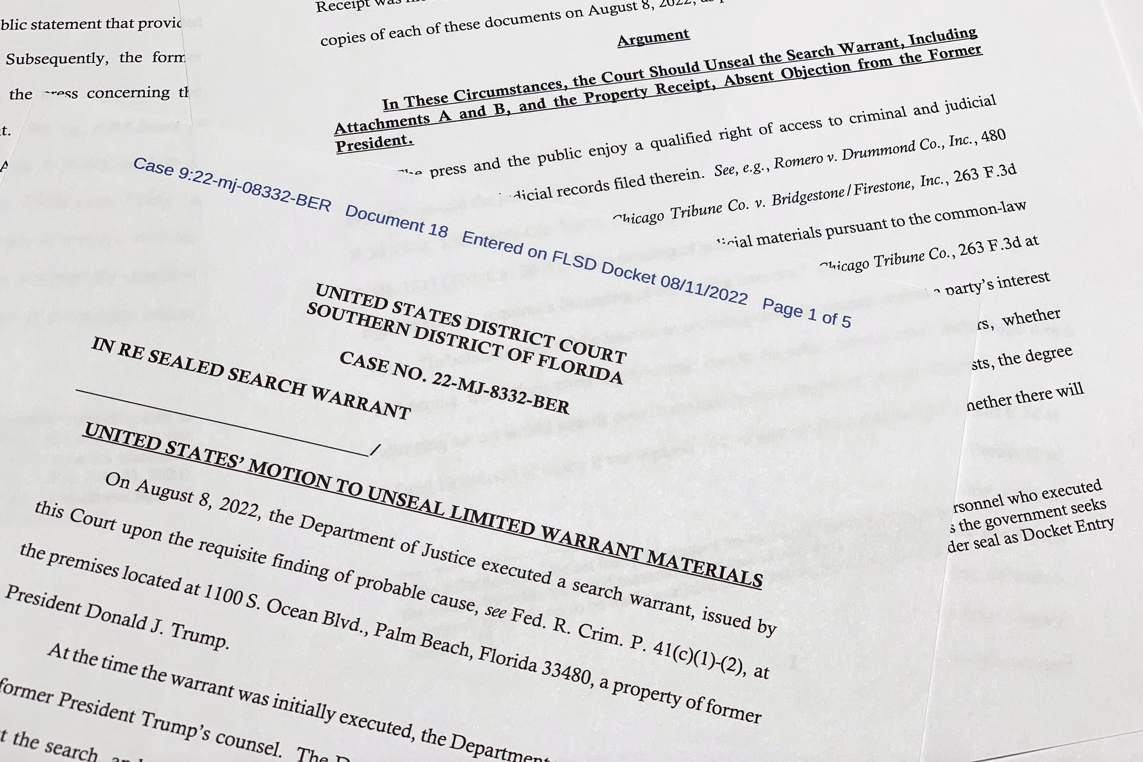 The motion by the Justice Department to the U.S. District Court South District of Florida to unseal the search warrant the FBI received before searching the Florida estate of former President Donald Trump, is photographed Thursday, Aug. 11, 2022. Attorney General Merrick Garland cited the "substantial public interest in this matter" in announcing the request. (AP Photo/Jon Elswick)