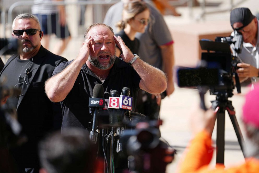 PHOTO: InfoWars founder Alex Jones speaks to the media outside Waterbury Superior Court during his trial on September 21, 2022 in Waterbury, Connecticut.