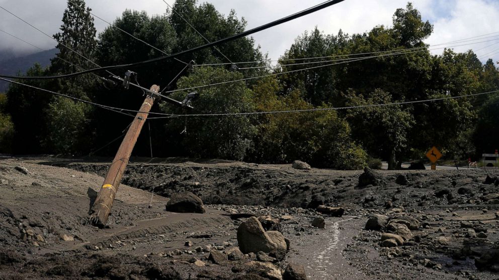 PHOTO: Electric poles are seen half-fallen in the aftermath of a mudslide, Sept. 13, 2022, in Oak Glen, Calif. 