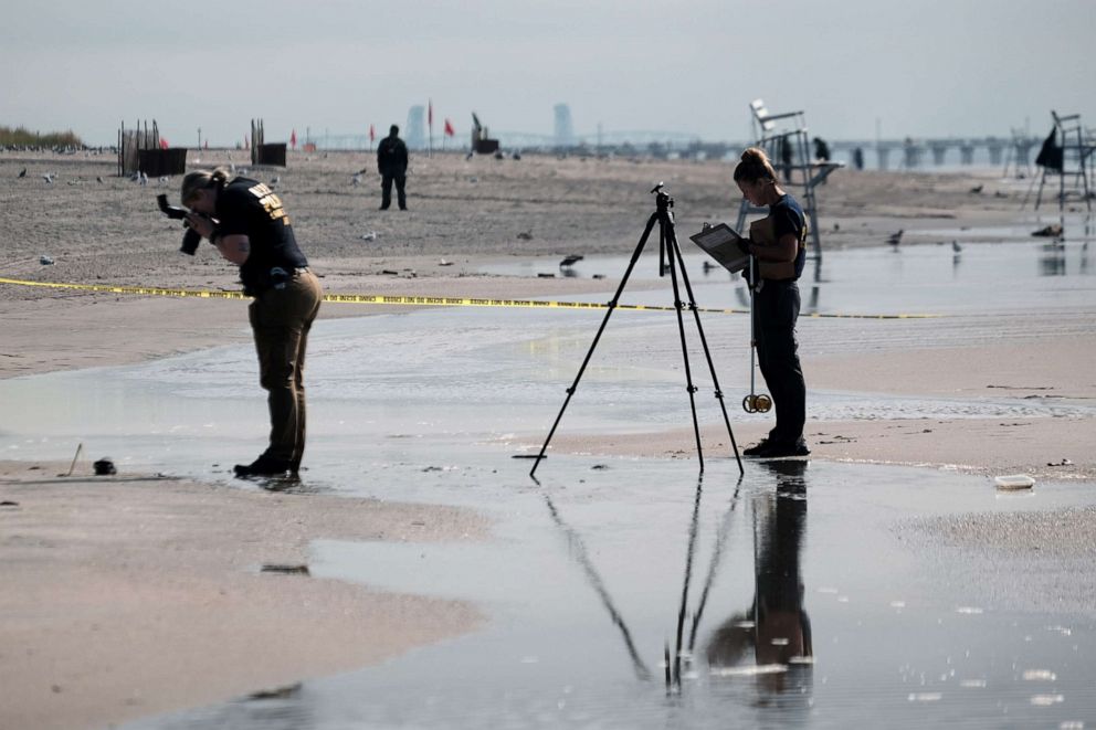 PHOTO: Police work along a stretch of beach at Coney Island which is now a crime scene after a mother is suspected of drowning her children in the ocean on Sept. 12, 2022, in the Brooklyn, New York.