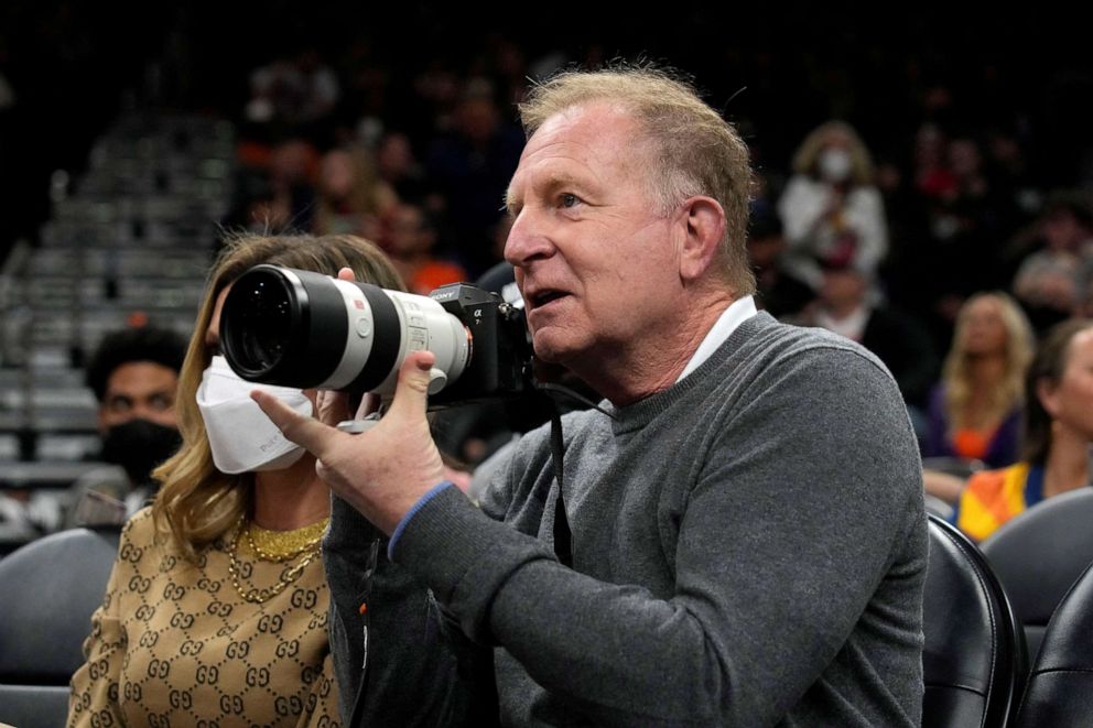 PHOTO: Phoenix Suns owner Robert Sarver takes images on Feb. 16, 2022, during a game against the Houston Rockets at Footprint Center.