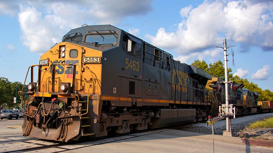 A yellow and black CSX Engine