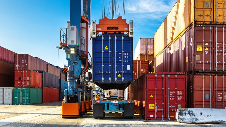 Cargo containers being unloaded from ship