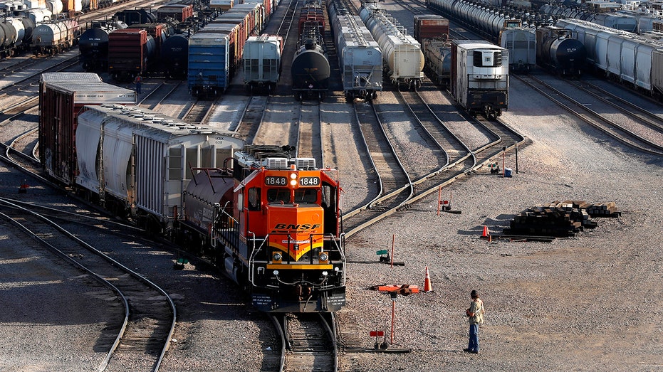 A BNSF train pulls out of yard