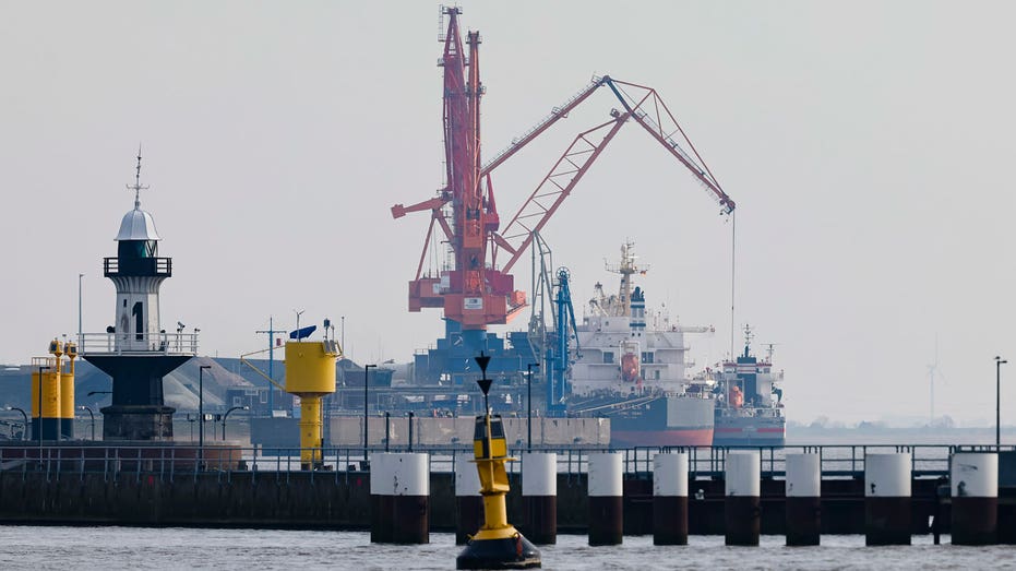 Large machinery at a LNG port on the water in Germany