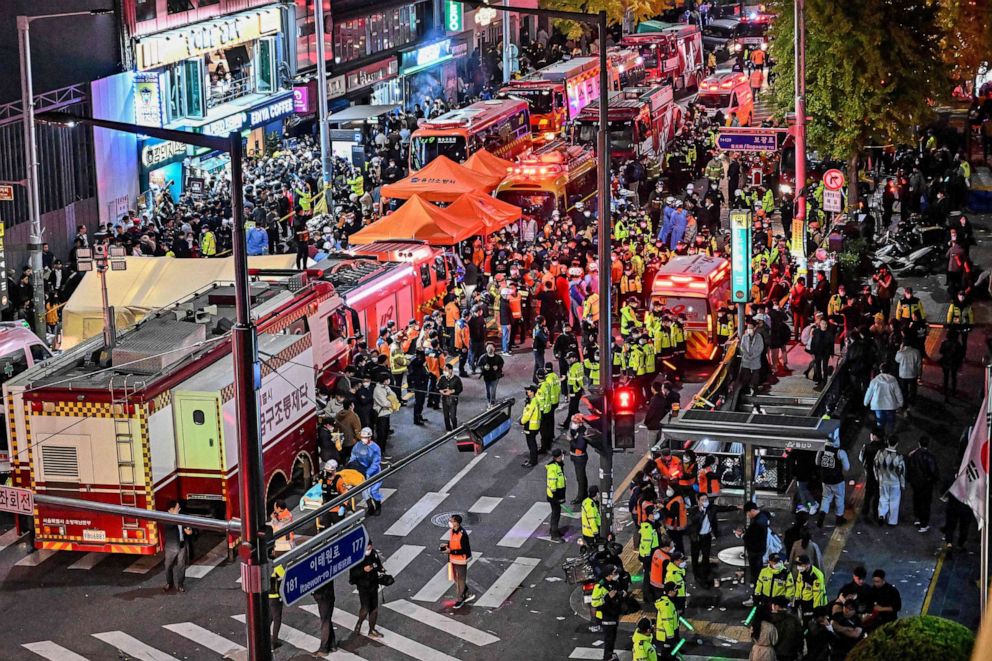 PHOTO: Onlookers, police and medical staff gather after dozens were injured in a stampede, after people crowded into narrow streets in the city's Itaewon neighbourhood to celebrate Halloween, in Seoul, South Korea, on Oct. 30, 2022.