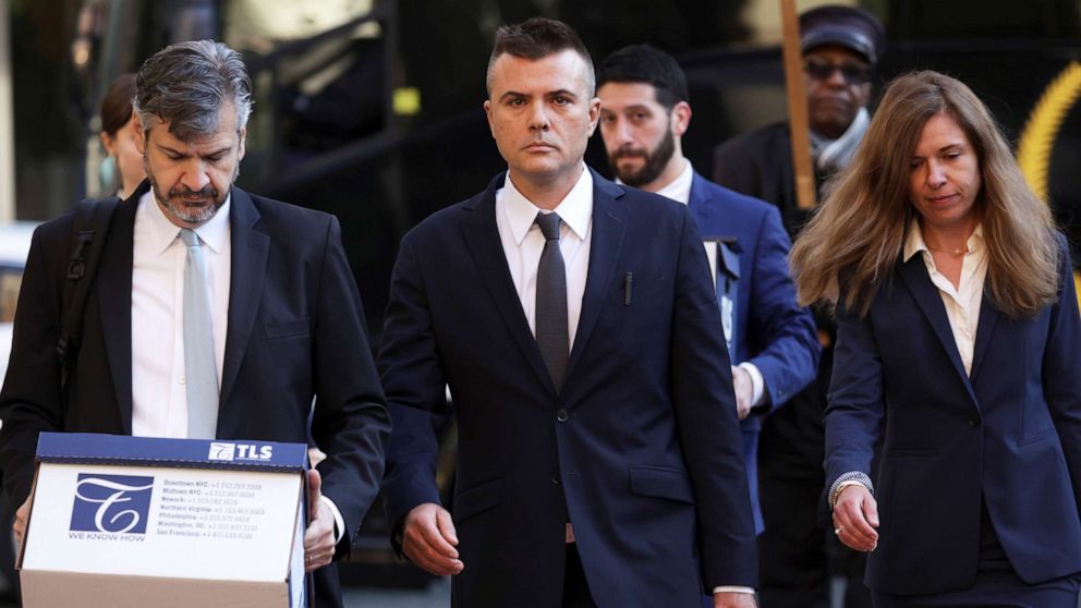 PHOTO: Russian analyst Igor Danchenko, center, arrives at the Albert V. Bryan U.S. Courthouse for his trial on Oct. 11, 2022 in Alexandria, Virginia. 