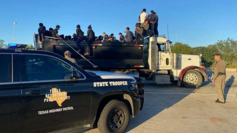 Man charged after dozens of migrants found in dump truck