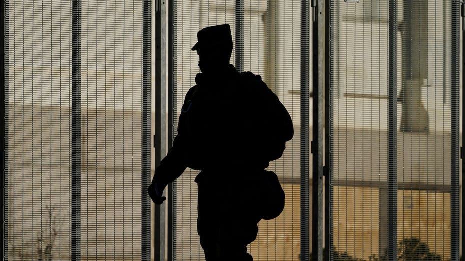 Silhouette of a soldier walking away