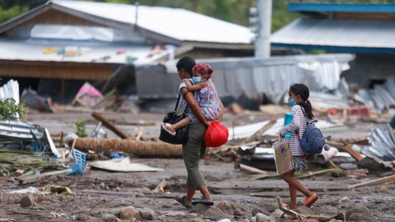 Nearly 100 dead, dozens missing in storm-ravaged Philippines