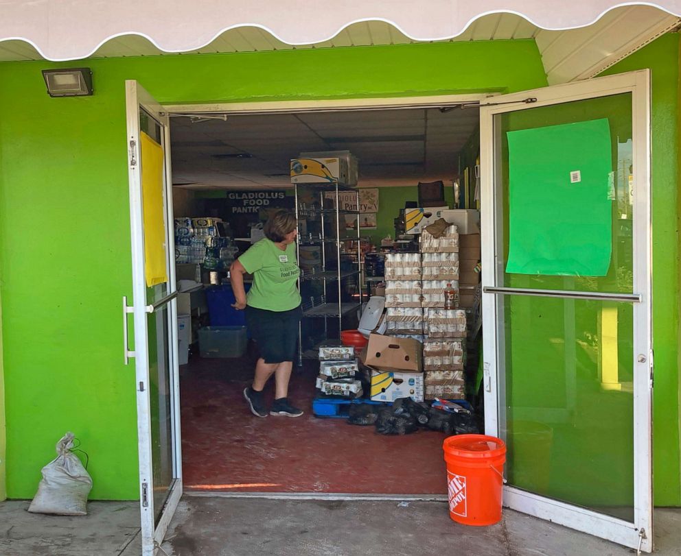 PHOTO: Miriam Ortiz, the founder and director of the Gladiolus Food Pantry, looks through supplies in the food bank in Harlem Heights, Fla., Oct. 1, 2022.