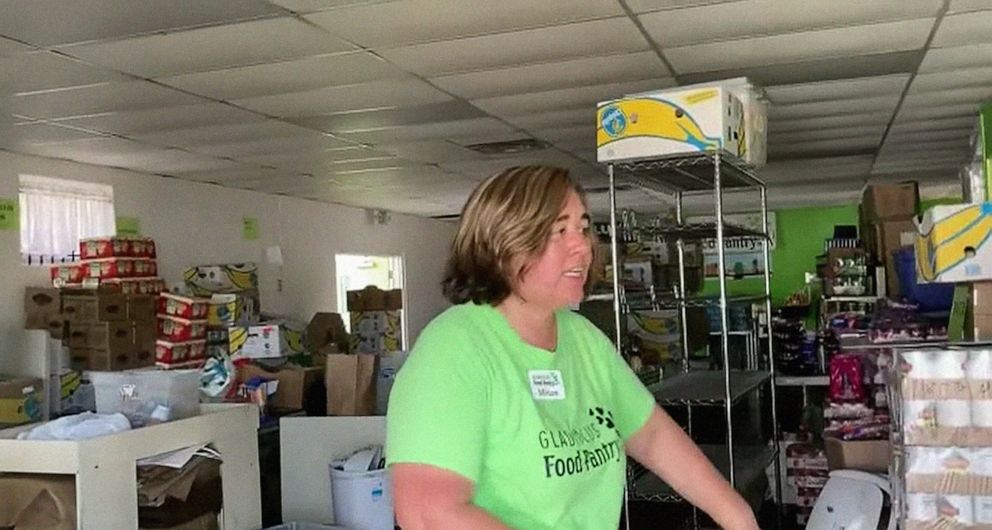 PHOTO: Miriam Ortiz, the founder and director of the Gladiolus Food Pantry, looks through supplies in the food bank in Harlem Heights, Fla., Oct. 1, 2022.