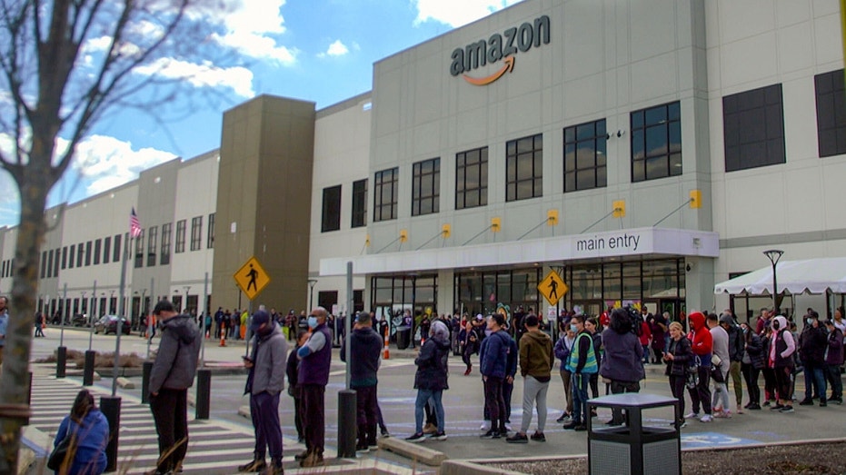 Amazon workers outside facility