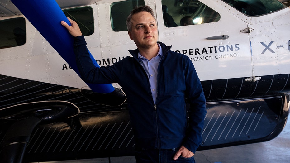 Xwing CEO leans against Superpilot plane