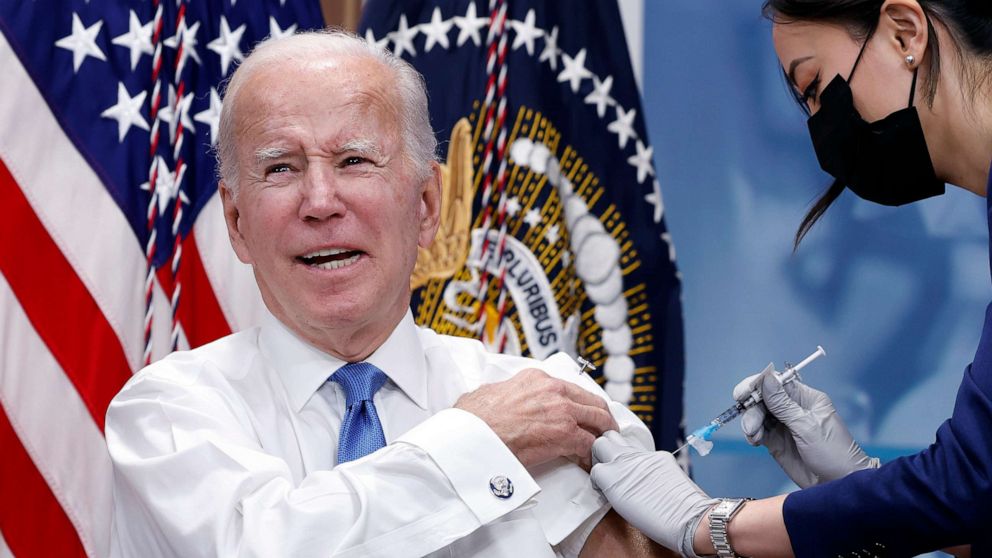 PHOTO: President Joe Biden receives his updated COVID-19 booster in the South Court Auditorium at the White House campus on October 25, 2022 in Washington, DC.