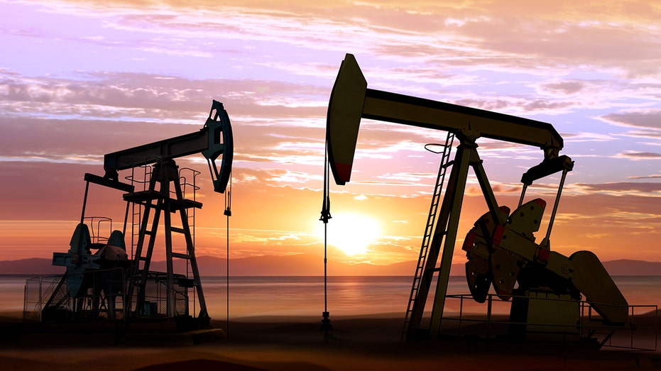 oil wells on sunset background
