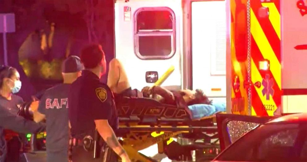 PHOTO: An ambulance removes Erik Cantu from the shooting scene as emergency personnel respond to the scene of a police officer shooting a teenager outside of McDonalds in San Antonio, Texas, Oct. 2, 2022.