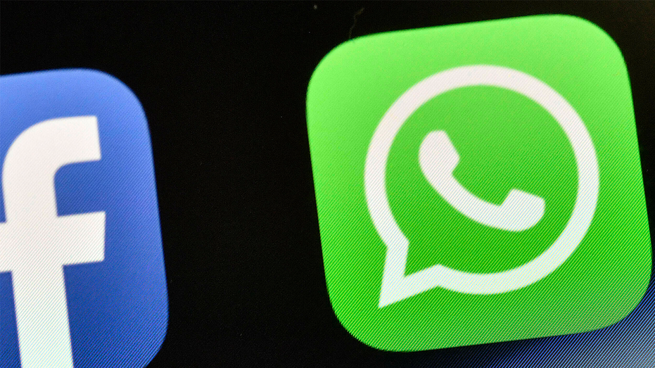 WhatsApp's green logo on a black phone background