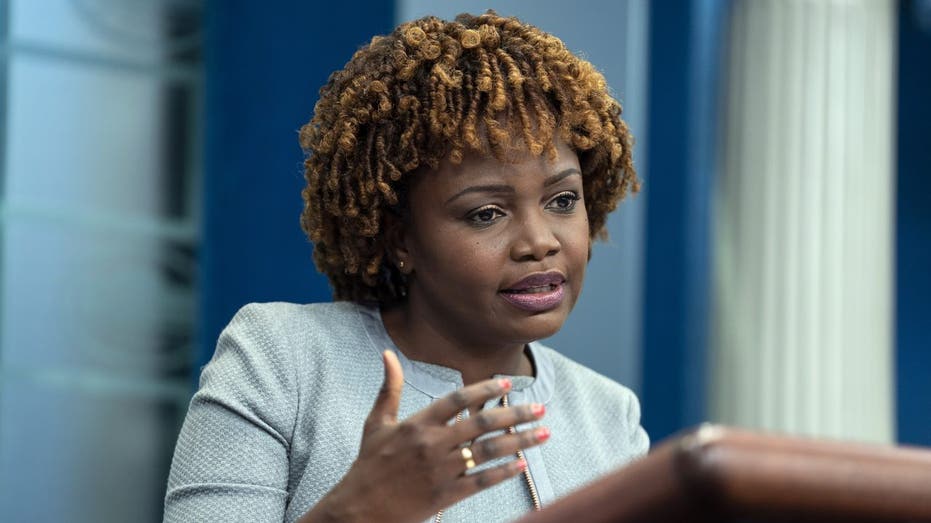 White House Press Secretary Karine Jean-Pierre speaks at a podium