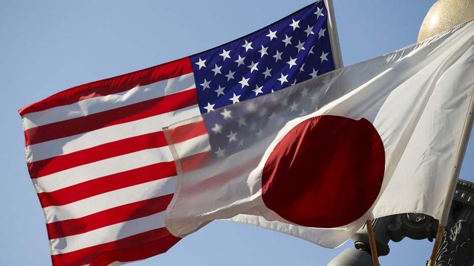 The U.S. flag and Japan flag flying next to each other